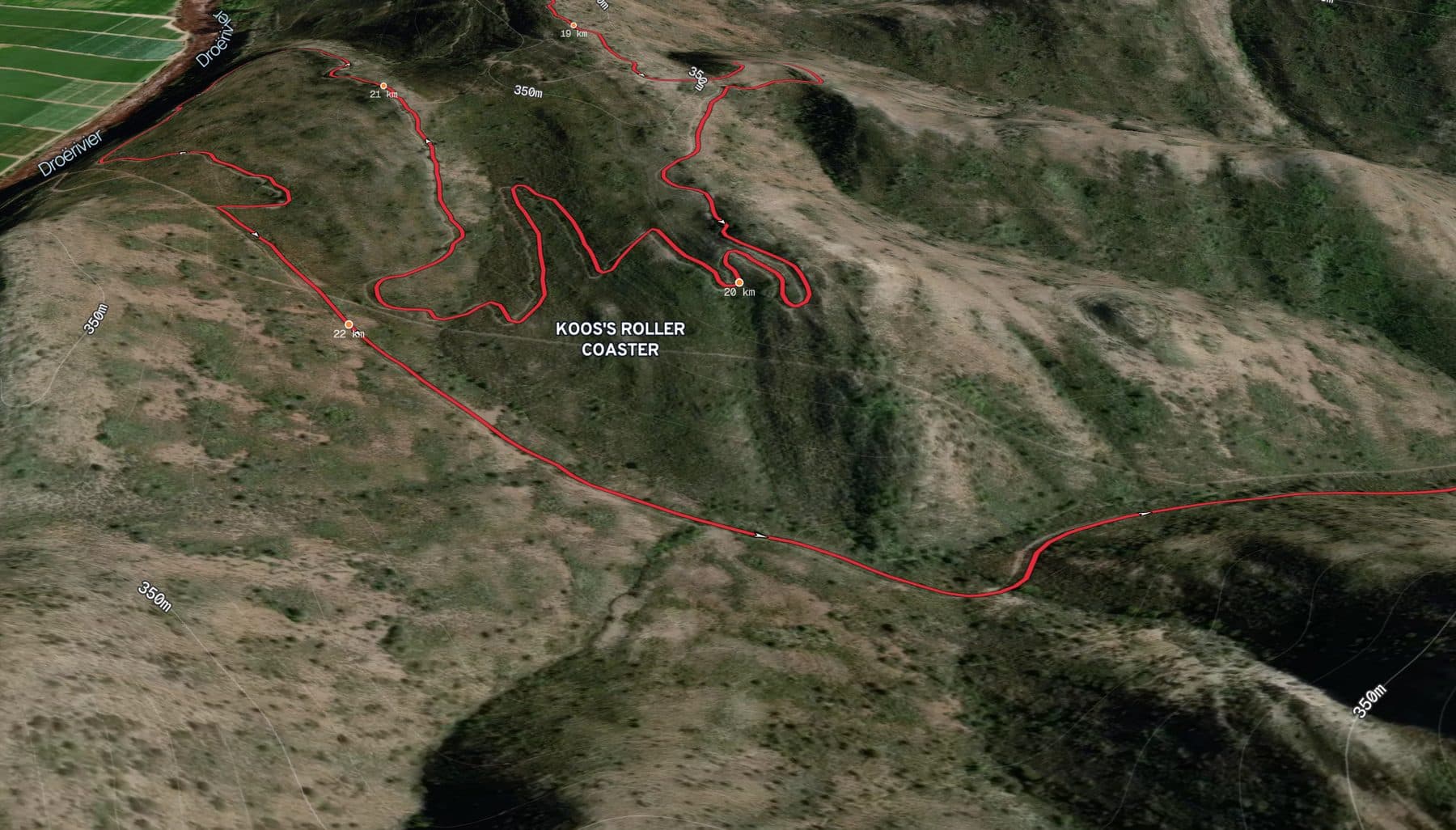 A sponsored stretch of the Cape Epic route drawn in the sponsor's red, switchbacking across 3D terrain at Koos's Roller Coaster